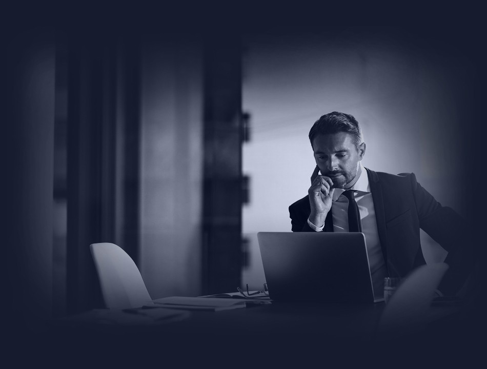 Businessman looking at his laptop