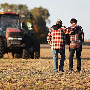 Roy Bardole walks with his grandson Gabe Bardole during the soybean harvest at the Bardole & Son's Ltd farm on October 14, 2019 in Rippey, Iowa.